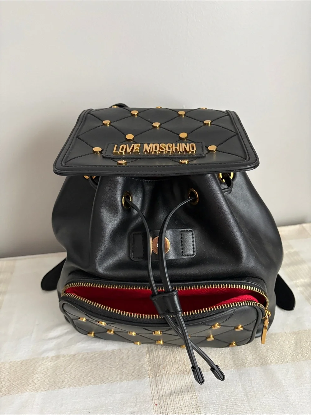 BNWOT Designer LOVE MOSCHINO Backpack, Faux Leather, with gold metal design.